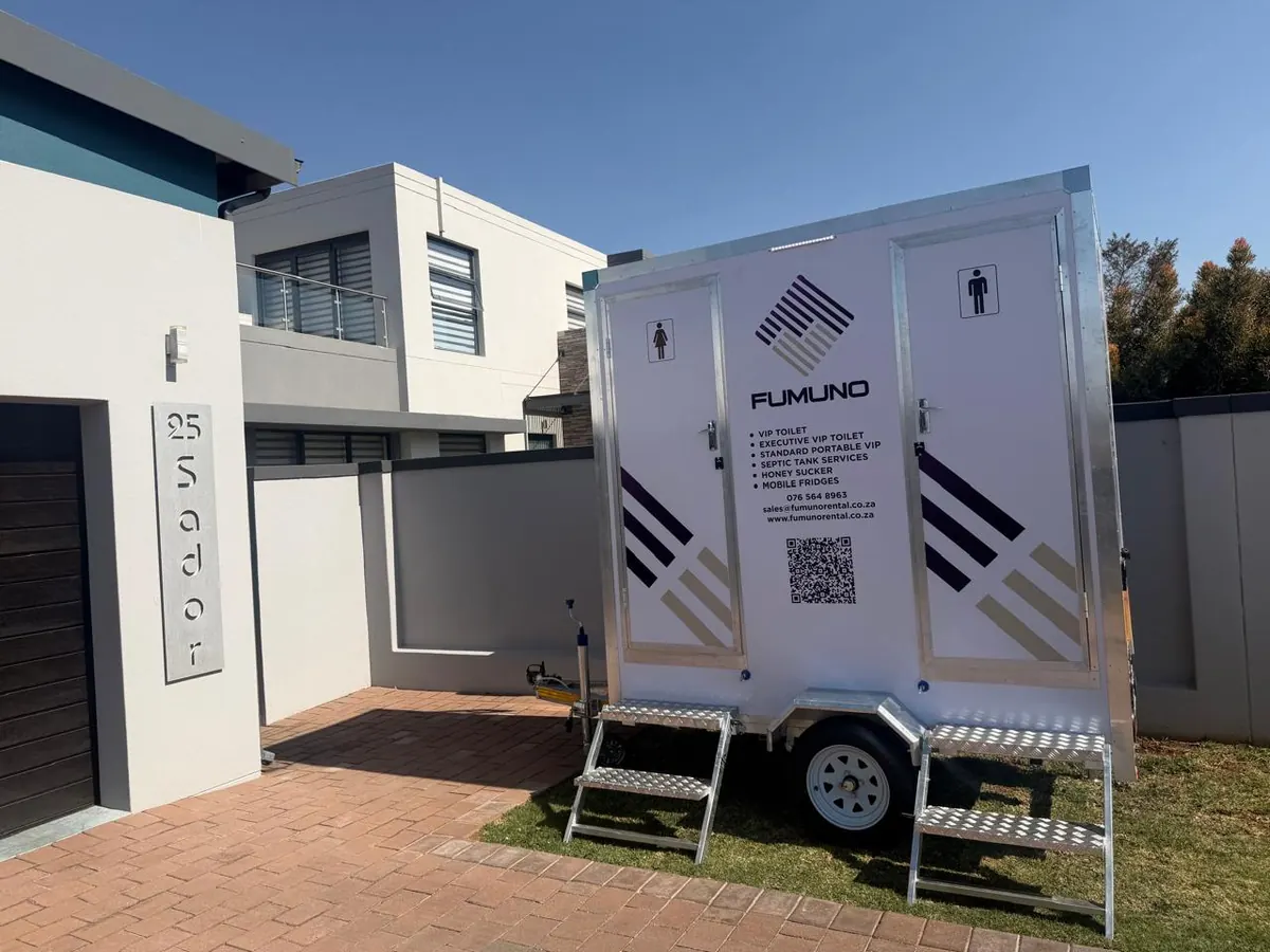 Fumuno twin-door VIP mobile toilet trailer set up outside a modern home in Gauteng for a private function