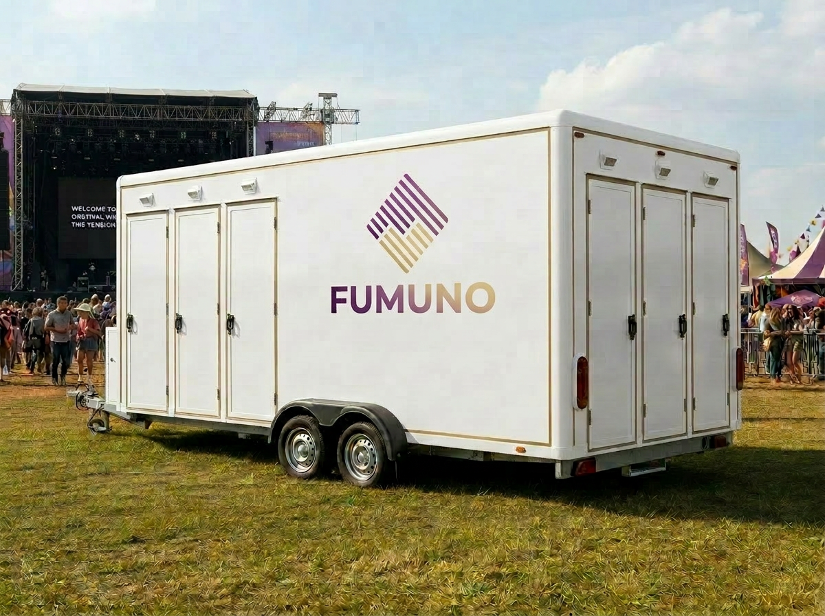 Fumuno branded urinal trailer at an outdoor festival